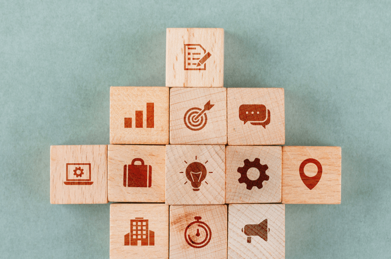 1e28e8a6 business strategy concept with wooden blocks with icons 1.png